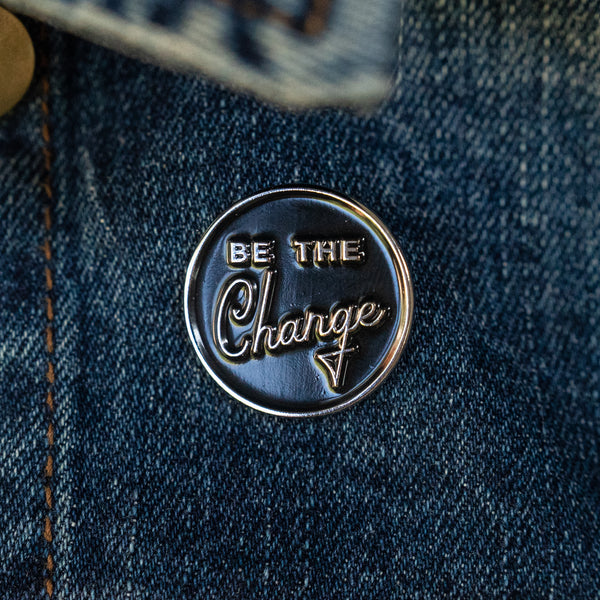 Be the change you wish to see enamel lapel pin on jean jacket