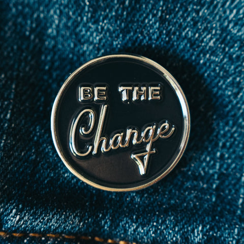 Be the Change enamel pin inspired by the famous Gandhi quote 