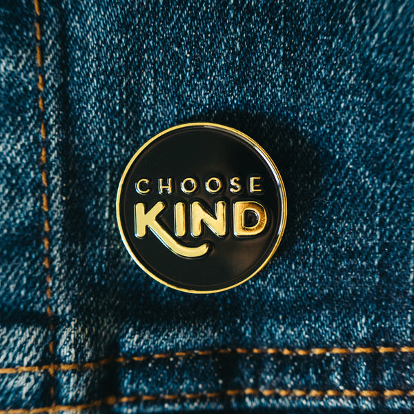 Choose kind enamel lapel pin on a denim jean jacket. Makes the perfect accessory. 