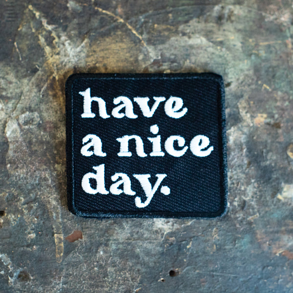 Have a nice day iron on or sew on patch on vintage wood table