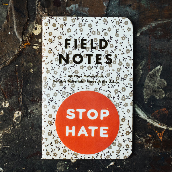 Stop Hate vinyl sticker on field notes book